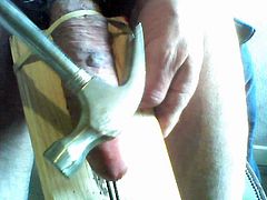 Beating my cock tied to a plank