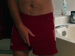 Daddy playing with his cock bulge in running shorts