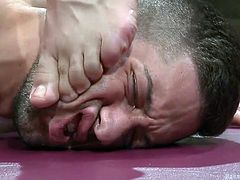 After an outstanding domination upon Kyle in the ring, Dylan celebrates, by humiliating his opponent, as is expected. He stands on Kyle's face, making him lick his toes. Kyle gets something out of it, as Dylan tongues his hairy ass.