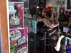 She is humiliated in the most embarrassing way possible. The nasty slut walks around the town square, flashing her pussy, as all the strangers on the street stare at her thick bush. When she arrives at the shop on the corner, things get worse for her. She is tightly hanged in shibari and made to look like a fool.