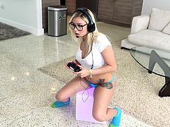 Marsha is deep into her game, but part of her mind is wishing that a hard cock was deep into her pussy! Her boyfriend walks in the room and she doesn't hesitate to stop playing and start sucking. Now he's hard and rocking her from behind.