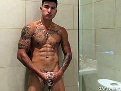 We received this amateur homemade video from young and muscular Eric, and like all the others before its totally captivating. This time he has decided to do a shower jerk off show and the inked Latino is already naked when he starts recording. All soaped up, that big uncut cock of his starts to grow in his hand and in no time Erick has it stiff. As he gets close we can see the intensity in his face and those muscles flex and the cum starts pumping.