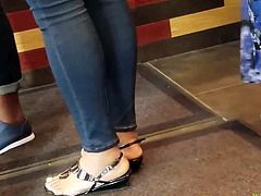 Sexy ebony feet in restaurant