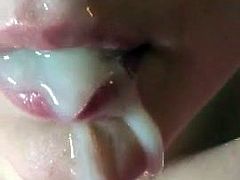 Close up cum shot into a whore mouth