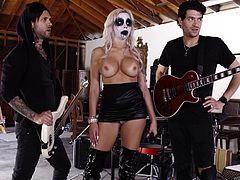 This goth babe is so turned on by the rock band, that she wants to have a hardcore gangbang. The beauty gets down on her knees and sticks those massive cocks in her mouth. She bounces up and down on that huge cock and takes it deep.