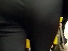 MILF's ass in black pants in once morning
