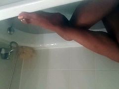 Crossdresser legs and feet in bath