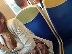 Sexy brunette teen downblouse on train
