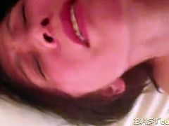 A chinese mature woman is filmed by some pervert as she dildo fucks herself, capturing mostly the look on her face as she pleasures herself.