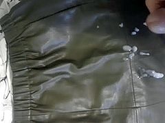 Cumshot on a green leather skirt