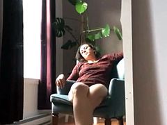 She came home with a horny shine in her eyes. She took a seat in her lazy chair and played with her huge. Big orgasm. She had no idea of the hidden camera.