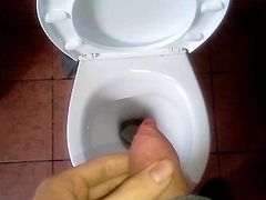 pissing with a penis to the toilet