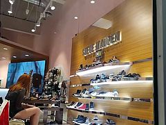 Candid voyeur in shoe store babe trying on shoes