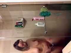 Girl Fondles Her nipples and Rubs Her Pussy before getting in the shower
