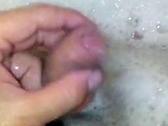 Playing with cock in the bath