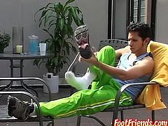 Slim homosexual Rodrigo shows his hairy feet outdoors