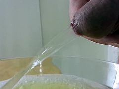 pissing it full and cumming into a bowl