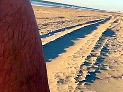 Boy wanks in The dunes of the beach