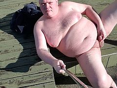 Fat man pissing