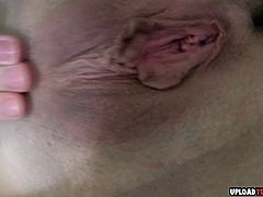 After she shows her legs in stockings, she will give a closeup of her pussy.