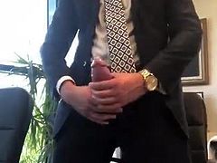 Suited daddy jerks in the office