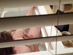 Spying on Debbie Juggs taking bath