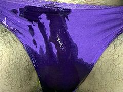 Purple panty pissing on the beach in a storm
