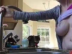 Bent over the kitchen sink