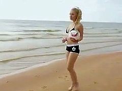 Hot blonde model posing at the beach