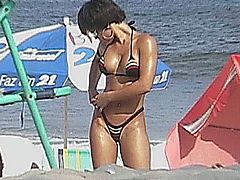 Super sexy ebony chick wearing bikini on the beach
