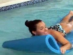Christina Model posing in a pool