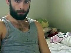 Cute bearded guy jerks off and cum all over the place