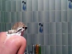 Voyeur - Cute redhead spied in the bathroom showering