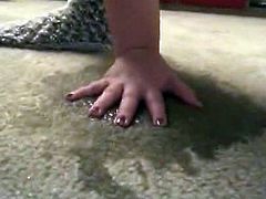 Lovely girl pissing on the carpet