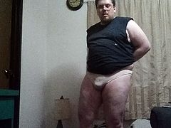 Fat guy wearing pink panties and flashing small penis to all