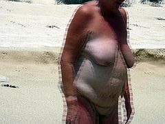 Nude Mature walking into the ocean