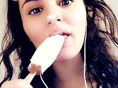 Young Turkish girl sucks her ice cream after classes