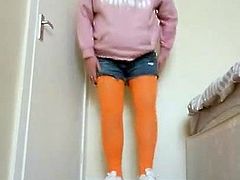 TRANSVESTITE wearing orange tights