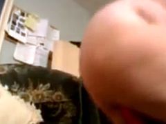Libby enjoys masturbating herself with a large red dildo