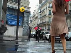 Beauty woman moves her ass in a long dress and high heels