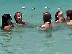 Group of topless friends on the beach, one with huge tits