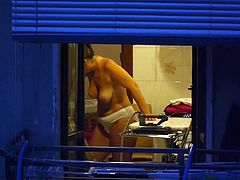 MILF topless in the kitchen