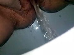 Hot and busty BBW pisses in extreme close-up