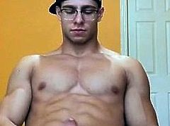 Muscular Guy in glasses jerking off and cumming