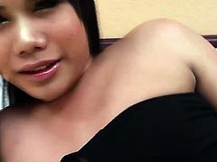 Tanned brunette ladyboy in black dress masturbates solo in